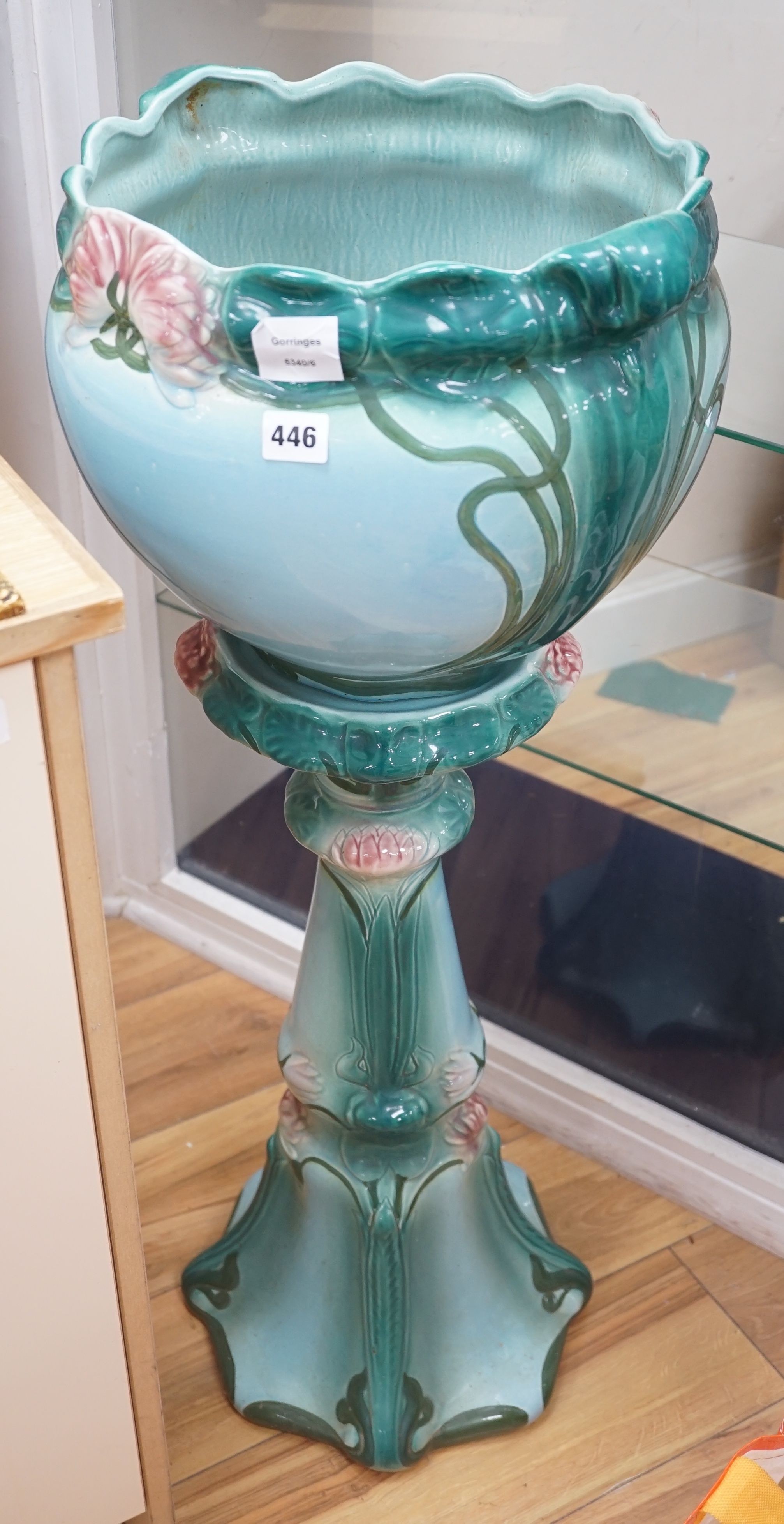 A Staffordshire pottery jardiniere on stand., 91 cms high.